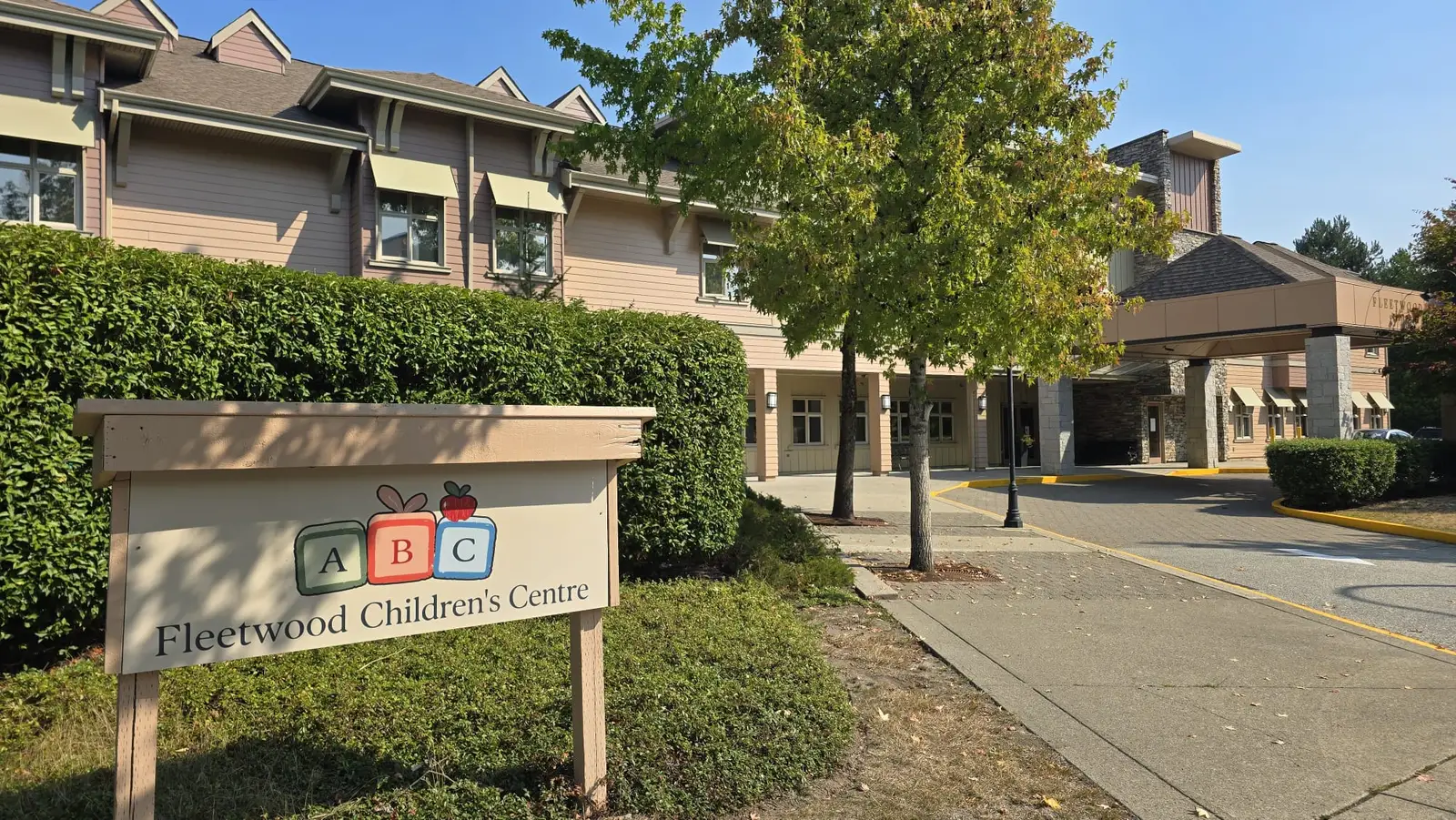 the Fleetwood Children's Centre sign and covered front entrance on 83 Avenue on a sunny day