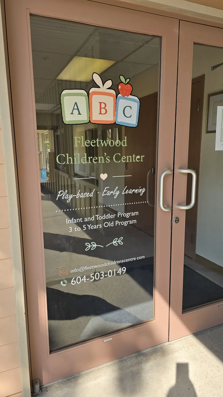 the front door of Fleetwood Children's Centre with our ABC blocks and programs on the glass